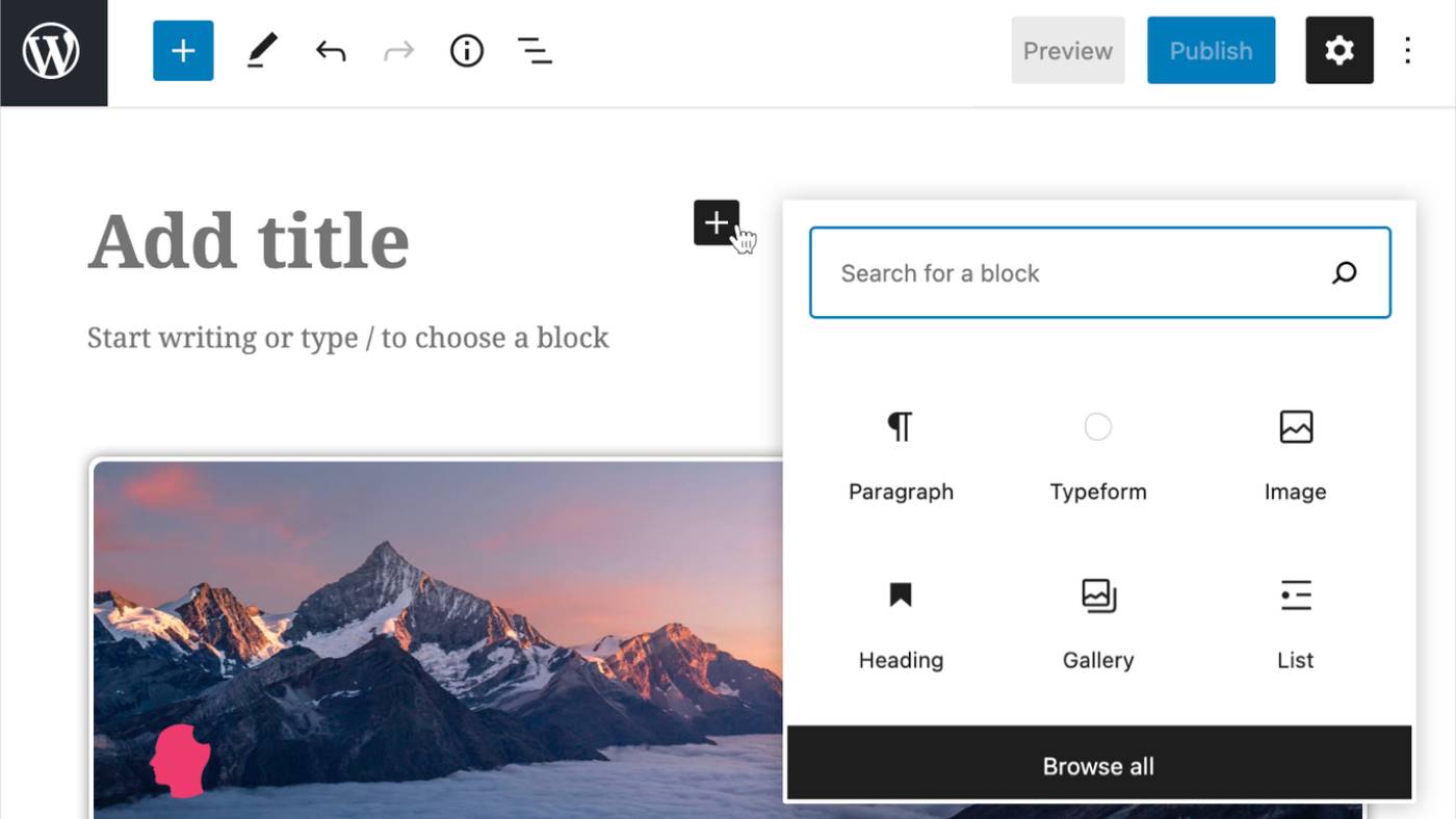 WordPress editor interface showing options to add blocks like Paragraph, Image, and Gallery. Background image features a mountain range with snow-capped peaks. Cursor hovers over the plus icon.